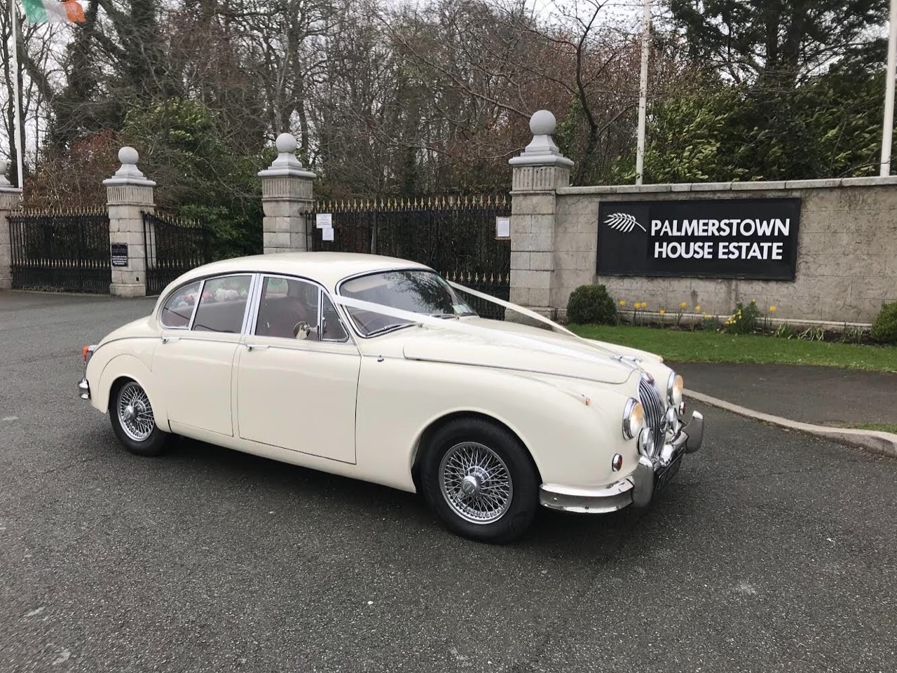 leaving Palmerstown House in our 1961 White Jaguar wedding car